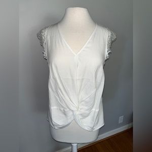 Boutique linen look sleeveless twist front top with lace trim